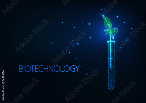 Futuristic biotechnology concept with glowing low polygonal green plant sprout in test tube.