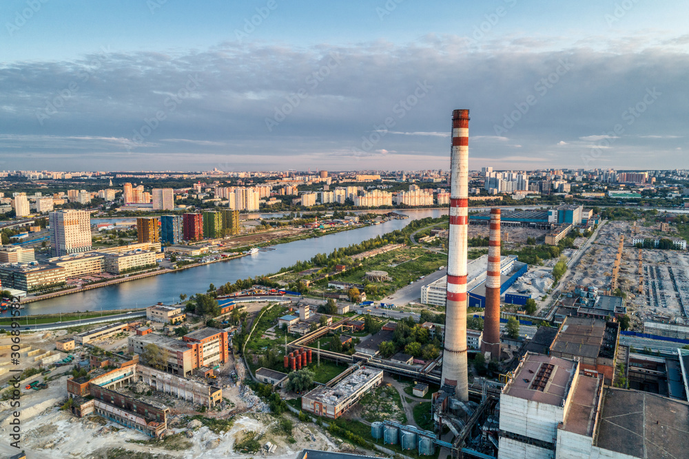 Inactive thermal power station located in the middle of a big city. Aerial view.