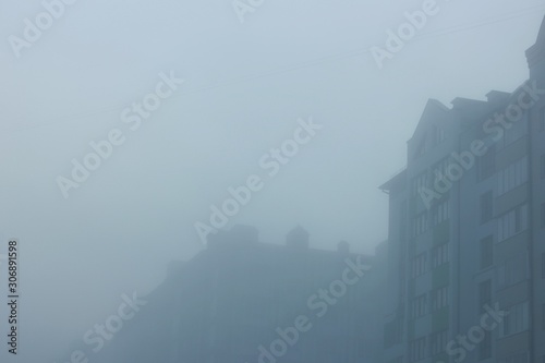 Thick morning fog on the city streets