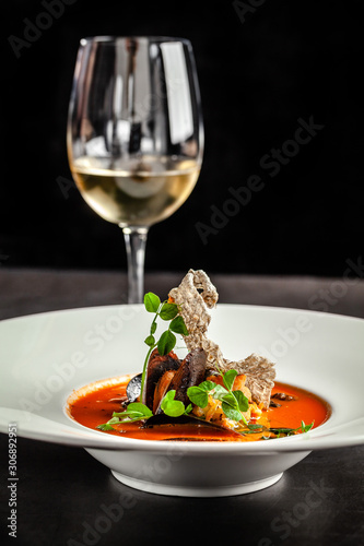 Spanish food concept. Gazpacho tomato soup with seafood  mussels and white wine. Background image.  copy space