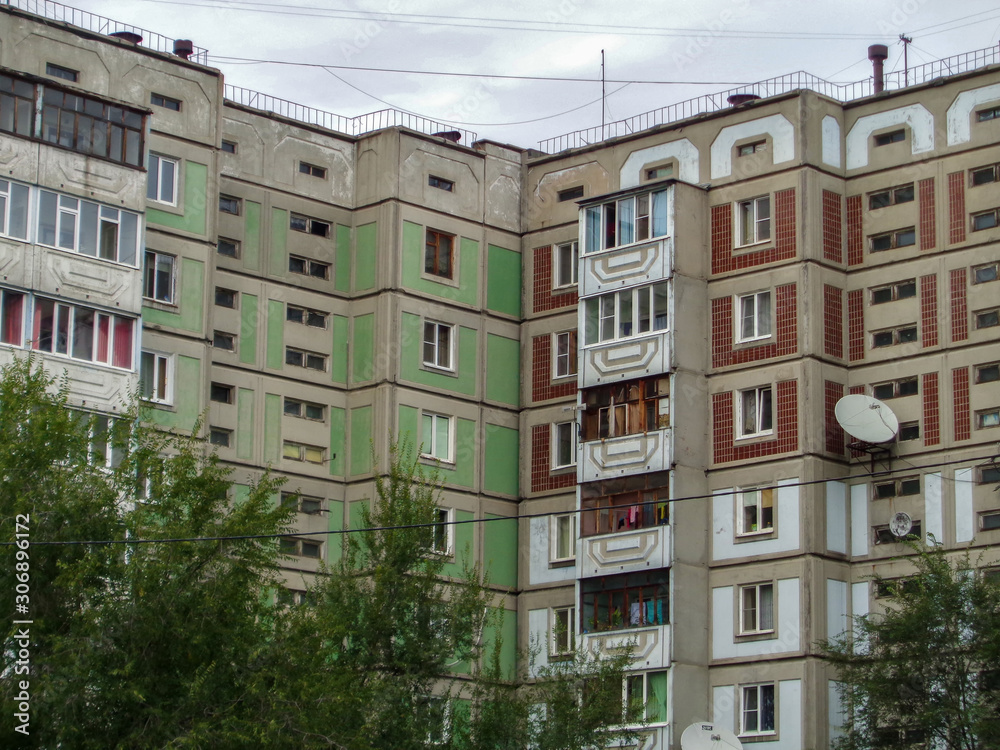 Soviet apartment buildings. Apartment block. Soviet architecture. Ust-Kamenogorsk (Kazakhstan). Concrete apartment buildings. Dark. Closeup detailed fragment. Plattenbau