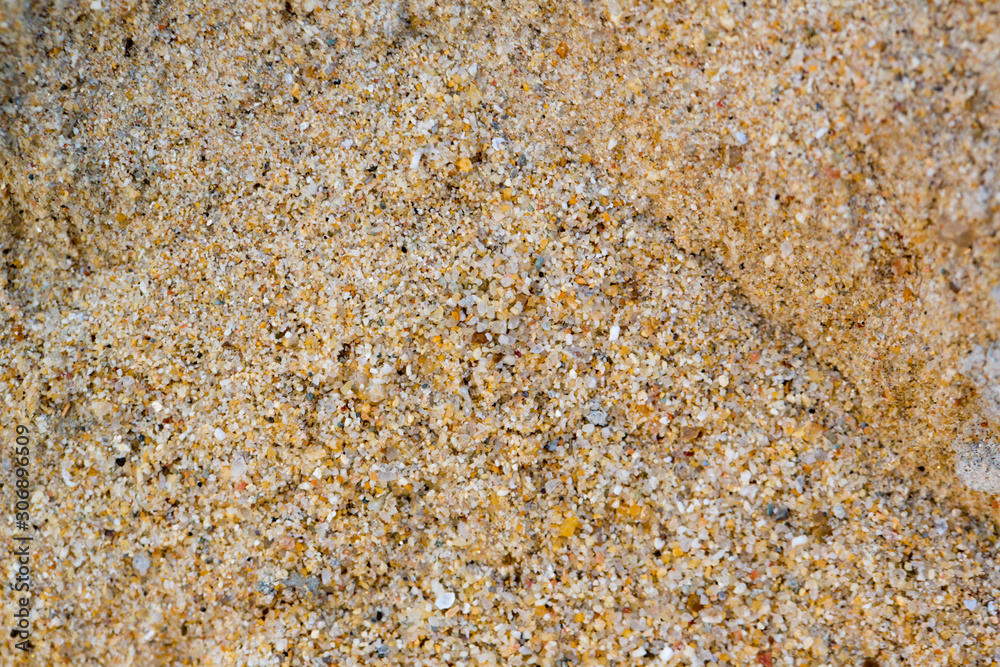 Natural sand stone texture background. sand on the beach as background. Art cream concrete texture for background in black. color dry scratched surface wall cover sand art abstract colorful relief. Natural sand stone texture background. sand on the beach as background. Art cream concrete texture for background in black. color dry scratched surface wall cover sand art abstract colorful relief.