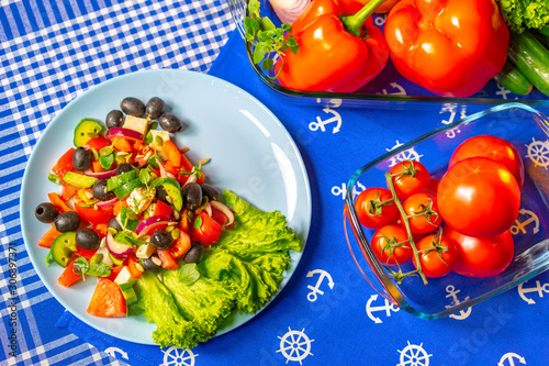 Greek salad. Cooking. Tomat...