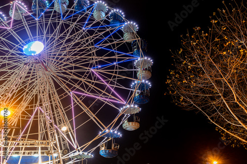 Fonte Nova's garden with Christmas market and colored ferris wheel near Ria de Aveiro at night