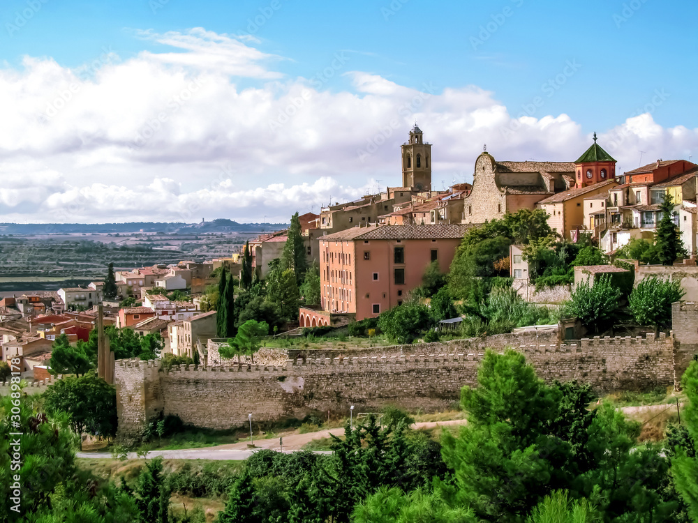 View of the Old City of Cervera in Catalonia (Spain). Beautiful Catalan landscape of a medieval town with an ancient wall on a background of a valley