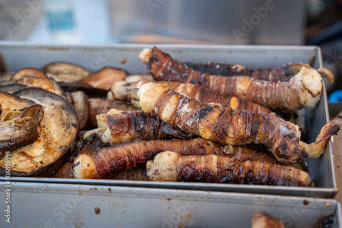 Stigghiola a typical dish of Sicilian and Palermo cuisine, Stigghiole. Stigghiole -. lamb, goat or pork bowels flavored with onions and parsley and grilled over coals,
street food concept. photo