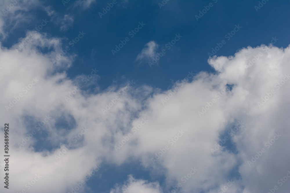 Clear blue sky and white clouds summer background Clear blue sky and white clouds summer background