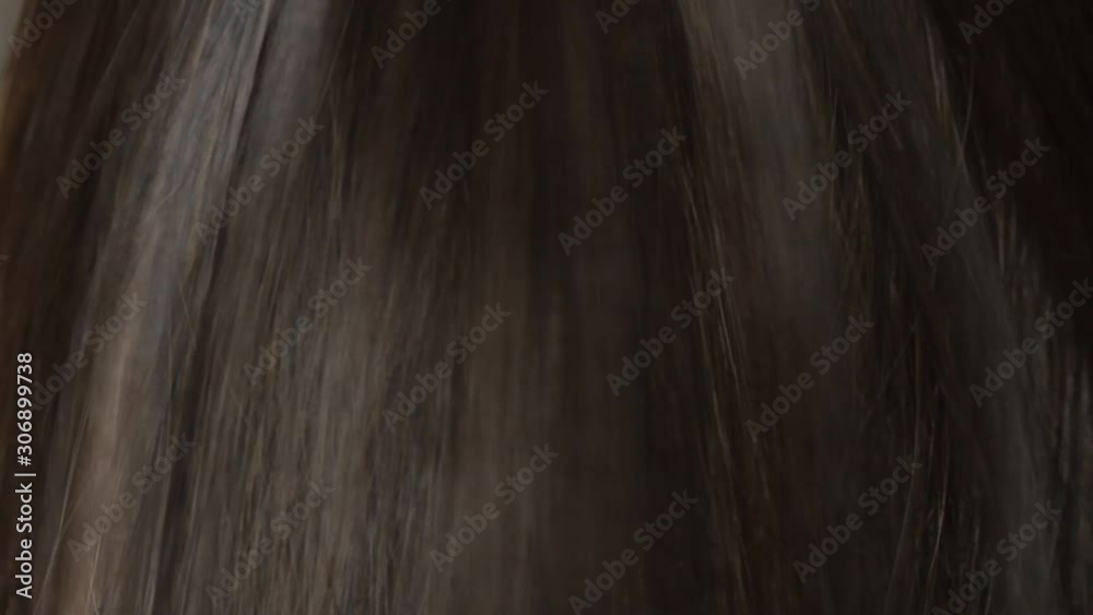 Close-up beautiful long smooth straight brown hair texture. Haircare concept, extensions, hair abstract background. HD video. Close-up beautiful long smooth straight brown hair texture. Haircare concept, extensions, hair abstract background. HD video.