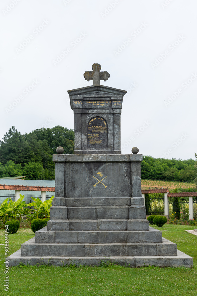 Cokesina, Serbia - July 12, 2019: The Cokesina Monastery belongs to the Serbian Orthodox Church. A monument with a tomb was erected in the monastery port in memory of the Serbian uprisings.