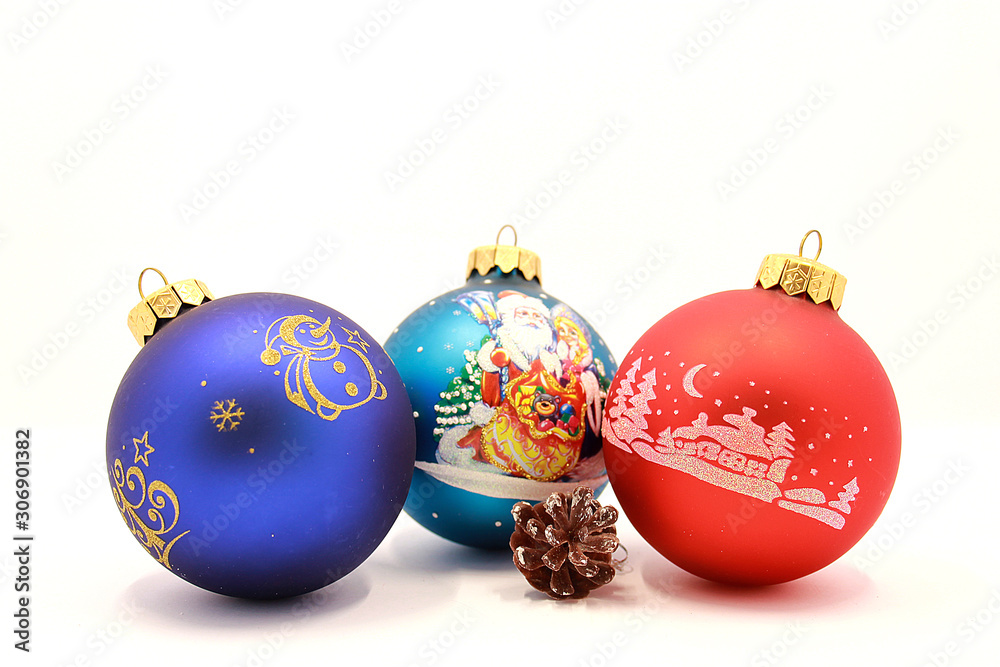 Photo of decorations for Christmas and New Year, a composition of decorations for the Christmas tree, holiday Christmas balls, isolated on white background Photo of decorations for Christmas and New Year, a composition of decorations for the Christmas tree, holiday Christmas balls, isolated on white background