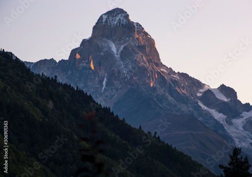 Ushba mountain peak at sunrise