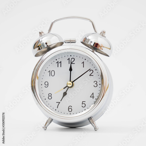Silver retro alarm clock on isolated