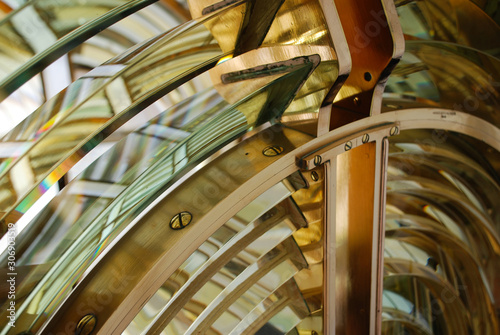 Lighthouse lens with brass structure and filaments lamp. Boanova lighthouse, Porto, Portugal.