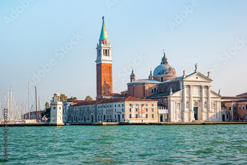 Bell tower and church of Saint George also called San Giorgio Maggiore in Venice, Italy © perekotypole