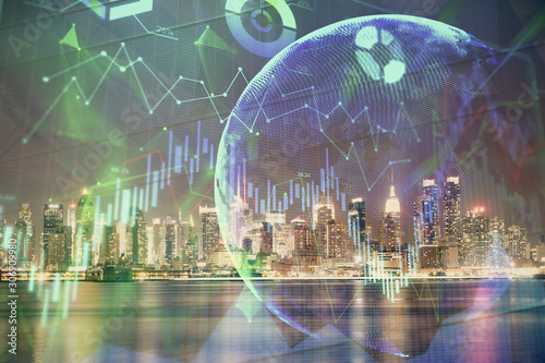 Financial graph on night city scape with tall buildings background multi exposure. Analysis concept.