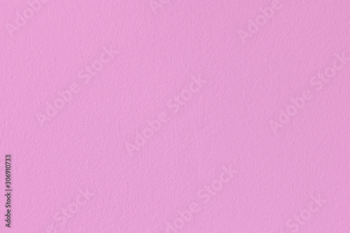 Empty pink paint plastered concrete wall