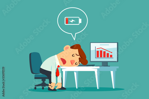 frustrated businessman at office desk with low battery icon