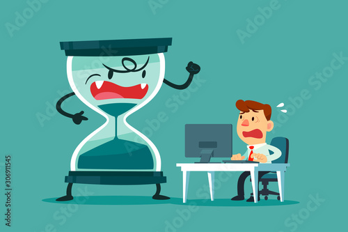 stressed businessman at his desk with big hourglass beside
