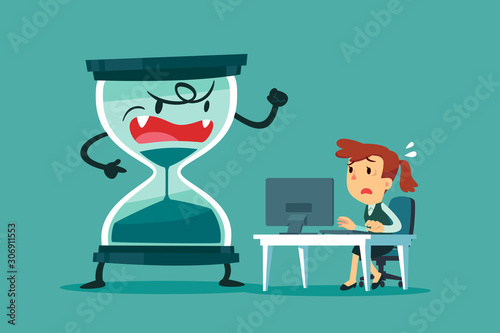 stressed businesswoman at her desk with big hourglass beside