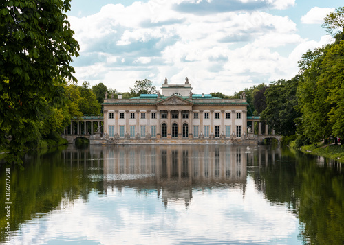 Frontal view of Lazienki Palace and lake in Lazienki Park, Warsaw