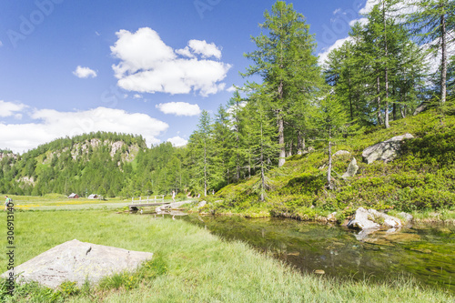 The small lake near Crampiolo known as the Lago delle Streghe, Alpe Devero, Antigorio valley, Piedmont, Italy photo