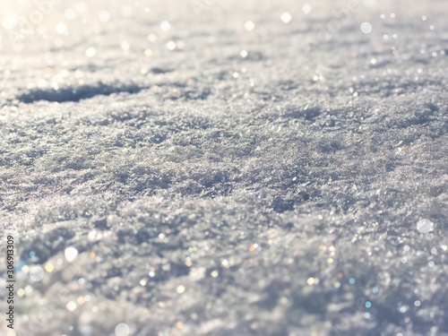 Beautiful magical winter snow background. Sparkling snow cold and warm shades in the early evening in the soft rays of the sun. 