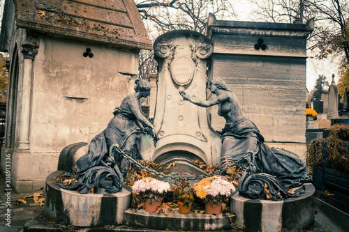 Paris, France - November 18, 2019: Graves and crypts in Pere Lachaise Cemetery, This cemetery is the final resting place for many famous people