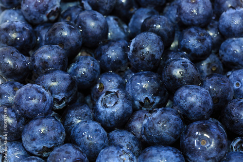 Fresh blueberry background. Texture blueberry berries close up view