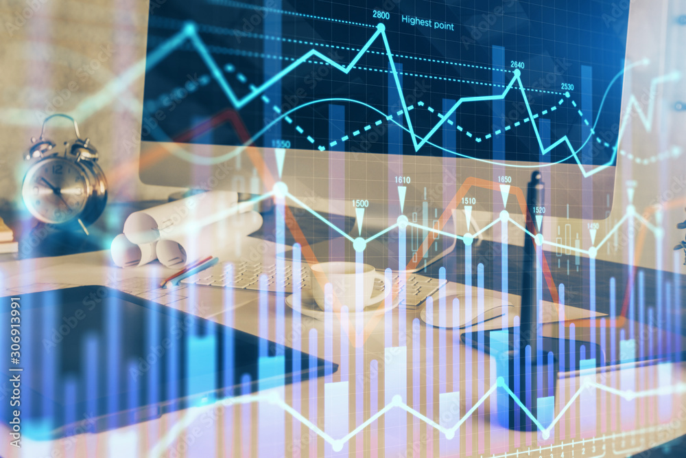Forex market chart hologram and personal computer background. Multi exposure. Concept of investment. Forex market chart hologram and personal computer background. Multi exposure. Concept of investment.