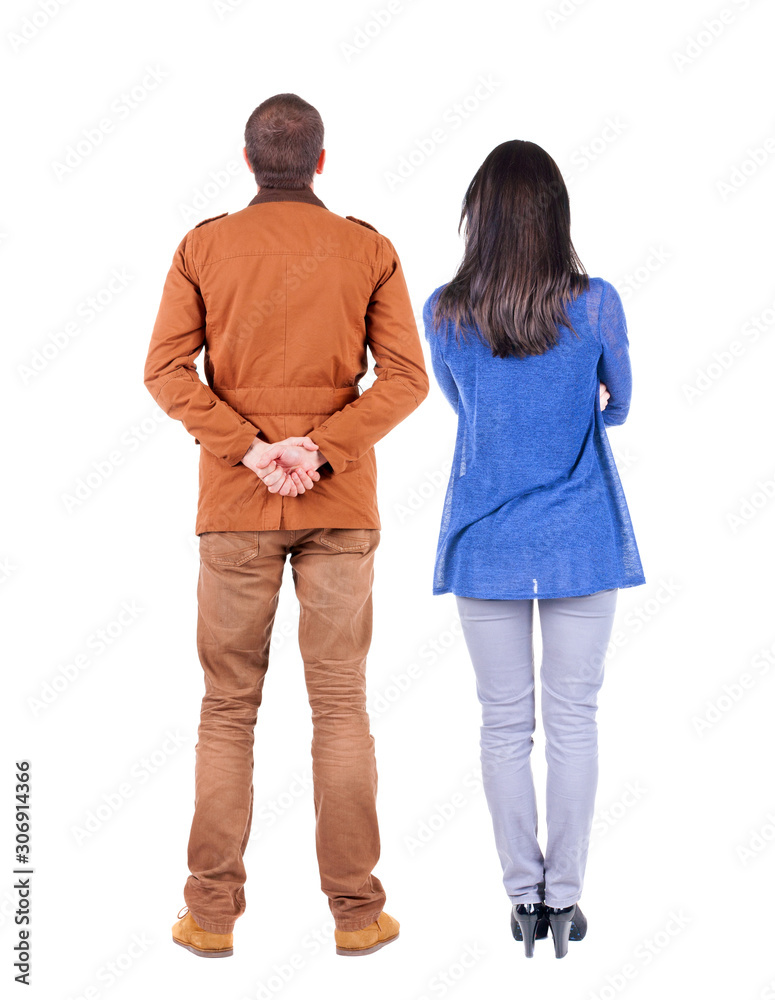 Back view of couple. beautiful friendly girl and guy together. Back view of couple. beautiful friendly girl and guy together.
