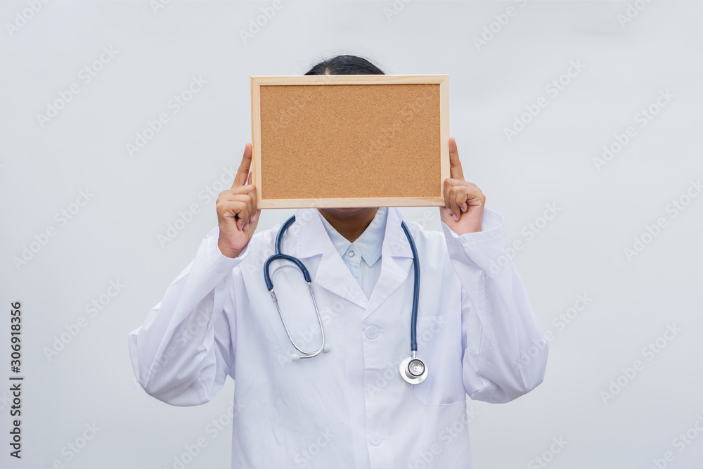 profession doctor in white coat over white isolated background with white blank board. Concept of healthcare, science and medicine concept profession doctor in white coat over white isolated background with white blank board. Concept of healthcare, science and medicine concept