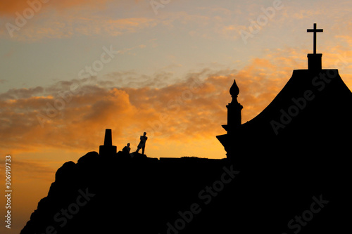 Chapel with people silhouette at sunset. Contre-jour. Le  a da Palmeira  Porto  Portugal.