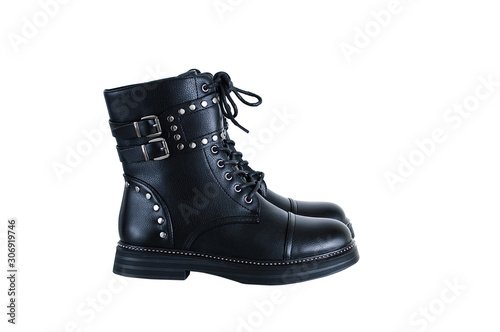 Black boot closeup with metal staves. White isolate