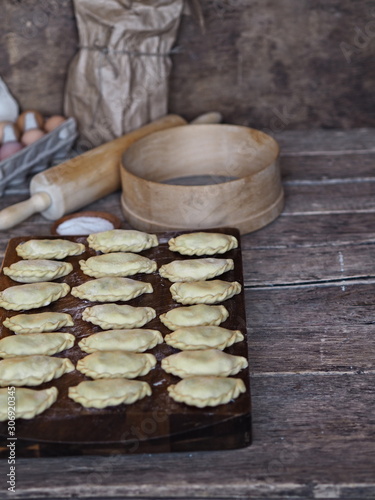 dumplings on a cutting board on a rustic table