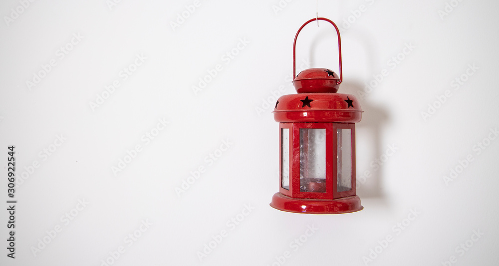Obraz premium decorative small red lamp decoration element hanging on white wall simple background pattern copy space for your text here 