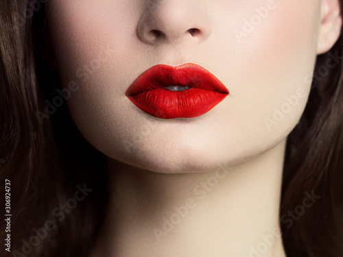 Sexual full lips. Natural gloss of lips and woman s skin. The mouth is closed. Increase in lips  cosmetology. red lips. Great summer mood with open eyes. fashion jewelry. pink lip gloss