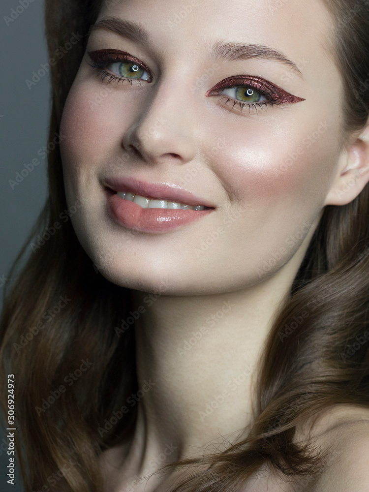 Beautiful brunet model woman face with green eyes and perfect make-up . Portrait of beauty young brunet girl with natural lips and eyes liner, thick eyesbrow . Female face with clear skin close-up. Beautiful brunet model woman face with green eyes and perfect make-up . Portrait of beauty young brunet girl with natural lips and eyes liner, thick eyesbrow . Female face with clear skin close-up.