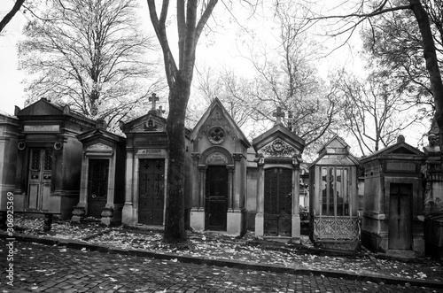 Fototapeta Naklejka Na Ścianę i Meble -  Paris, France - November 18, 2019: Graves and crypts in Pere Lachaise Cemetery, This cemetery is the final resting place for many famous people