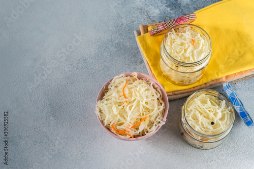  fermented sauerkraut village vegan salad in a glass jar. healthy product. rustic food. Probiotics concept.