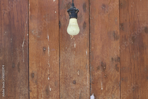 Wood texture with old light bulb