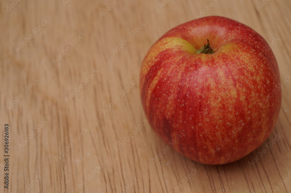 Close up of red apple on wood table background. Close up of red apple on wood table background.