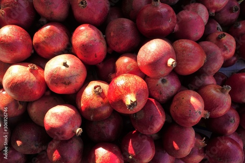 closeup of pomegranates on display at the market