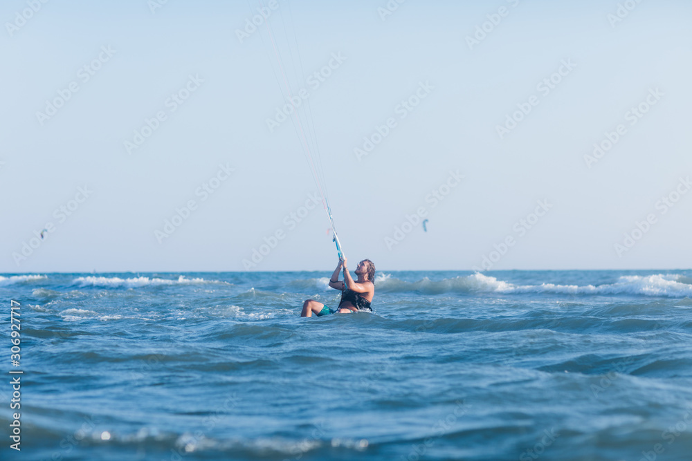 Man Kitesurfing on the Sea