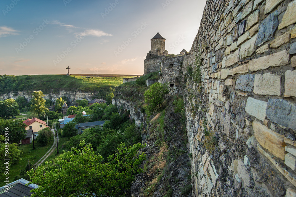 View of part of the Kamianets-Podilsky famous ancient fortresss and the fortress wall and the old city, Ukraine.