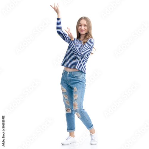 Woman in jeans and vest smile standing showing pointing on white background isolation