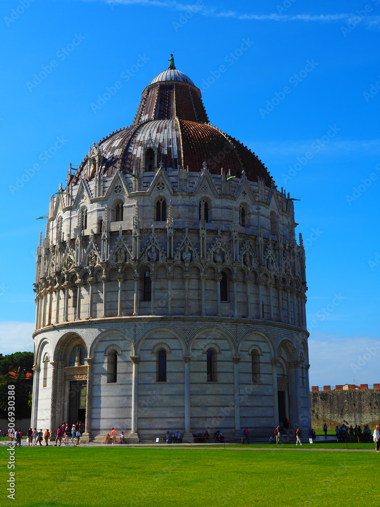 View of the Pisa Baptistery of St. John (Battistero di San Giovanni) in Pisa, Italy. It is located in Miracoli Square (Piazza dei Miracoli).