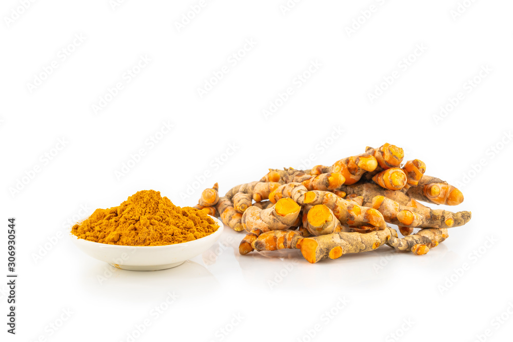 fresh turmeric root and turmeric powder in spoon on white background fresh turmeric root and turmeric powder in spoon on white background