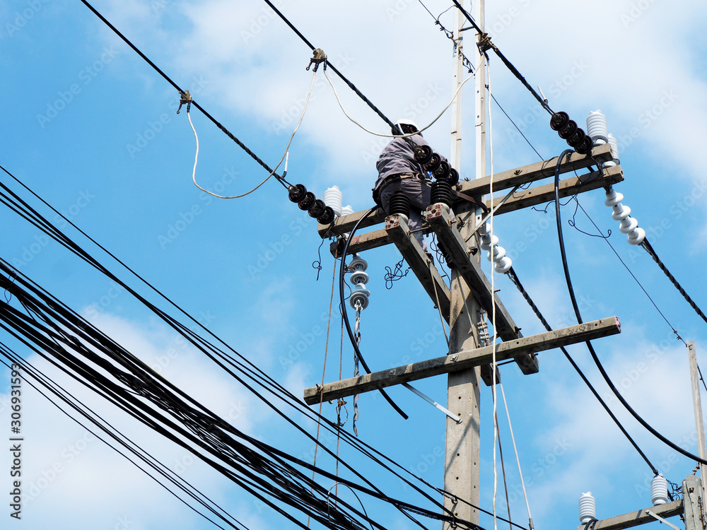 electrician man working at height and dangerous ,high voltage power line maintenance electrician man working at height and dangerous ,high voltage power line maintenance