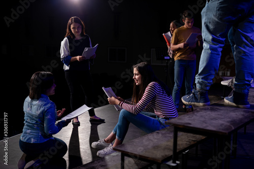Teenagers rehearsing in a theatre photo