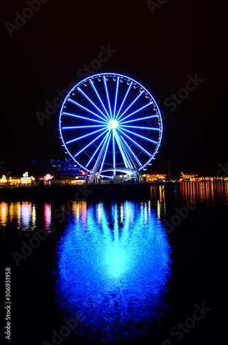 Giant Seattle Great Wheel observation in night reflection at Pier 57 in Seattle, Washington